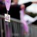 Volunteers hand out medals to participants of the Girls on the Run 5k on Sunday. Daniel Brenner I AnnArbor.com